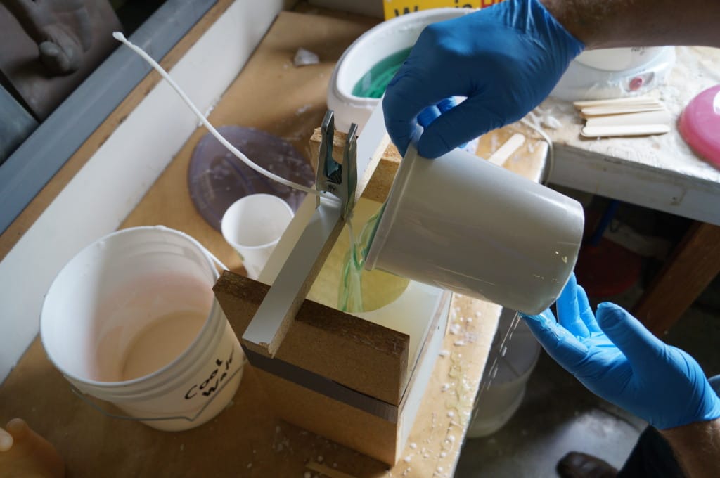 Pour Melted Wax into Mold Casting Wax in Polytek Silicone Mold