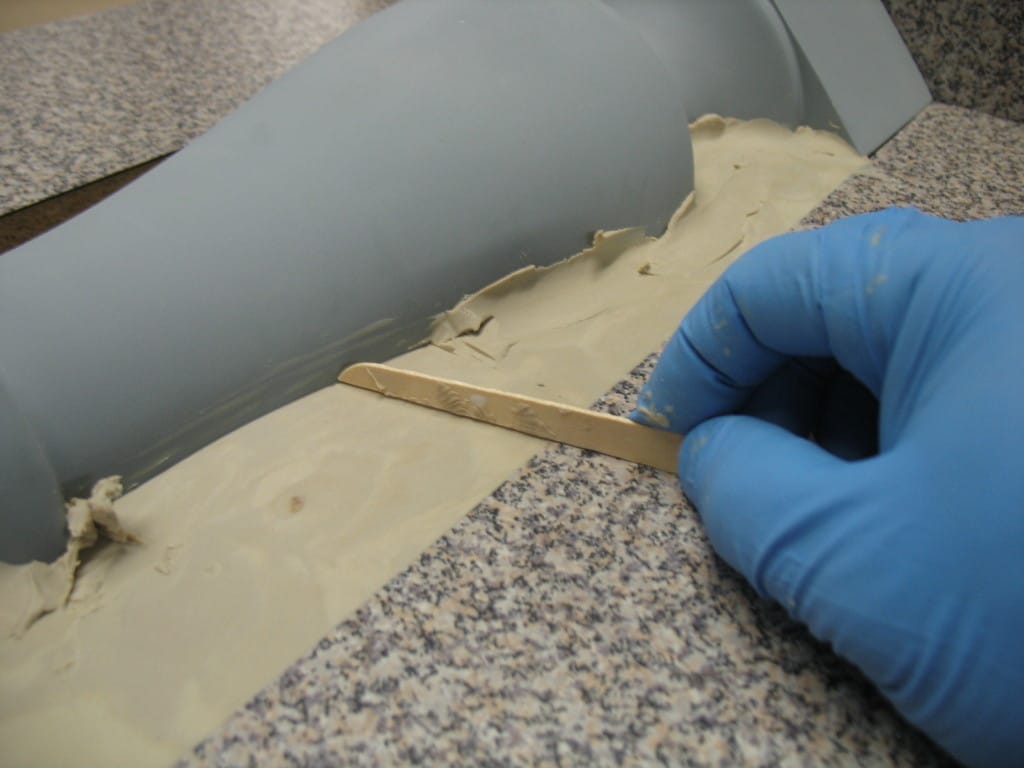 Smooth Clay with Tongue Depressor embedding models for mold making
